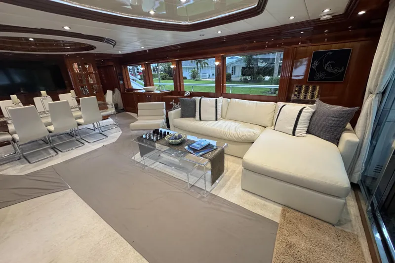 Aleniel Yacht Photos Pics Luxurious interior of 2005 Johnson 87' Motor Yacht with elegant seating and dining area.