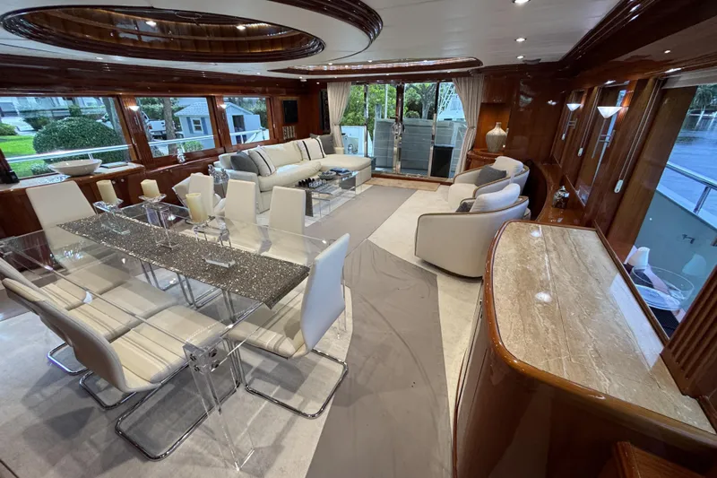 Aleniel Yacht Photos Pics Luxurious interior of a 2005 Johnson 87' Motor Yacht with elegant dining and seating areas.