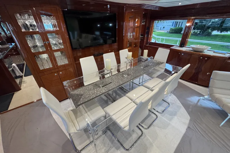 Aleniel Yacht Photos Pics Luxurious dining area on a 2005 Johnson 87' Motor Yacht with elegant decor.