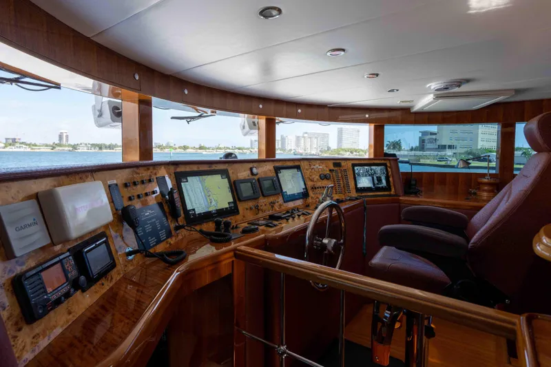 Aleniel Yacht Photos Pics Luxurious helm of 2005 Johnson 87' Motor Yacht with advanced navigation systems.