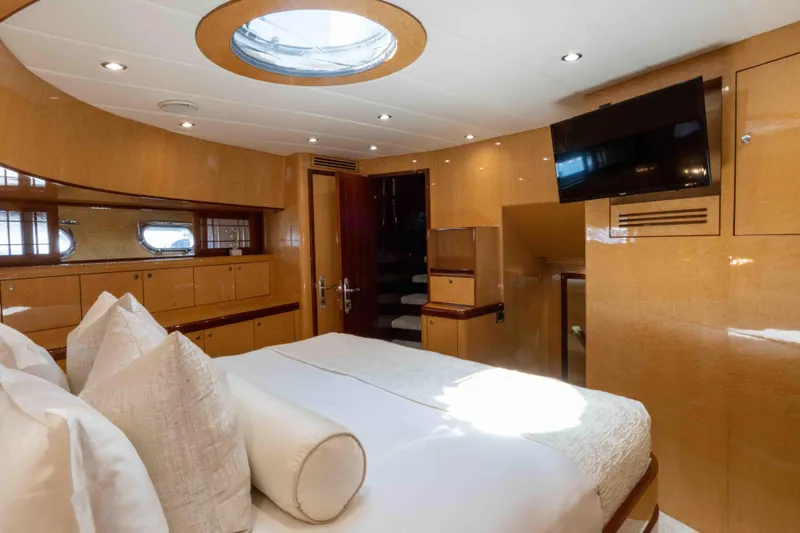 Aleniel Yacht Photos Pics Luxurious bedroom interior of 2005 Johnson 87' Motor Yacht with modern amenities.