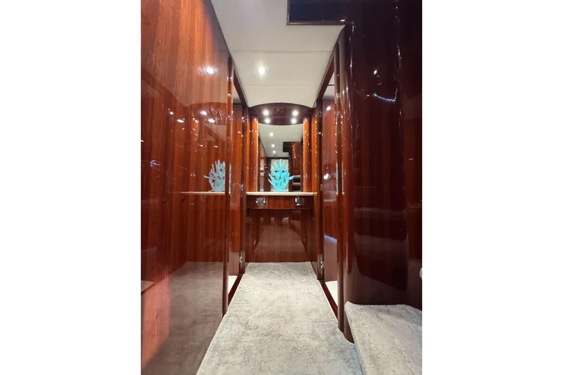Aleniel Yacht Photos Pics Luxurious hallway inside 2005 Johnson 87' Motor Yacht with polished wood finish.