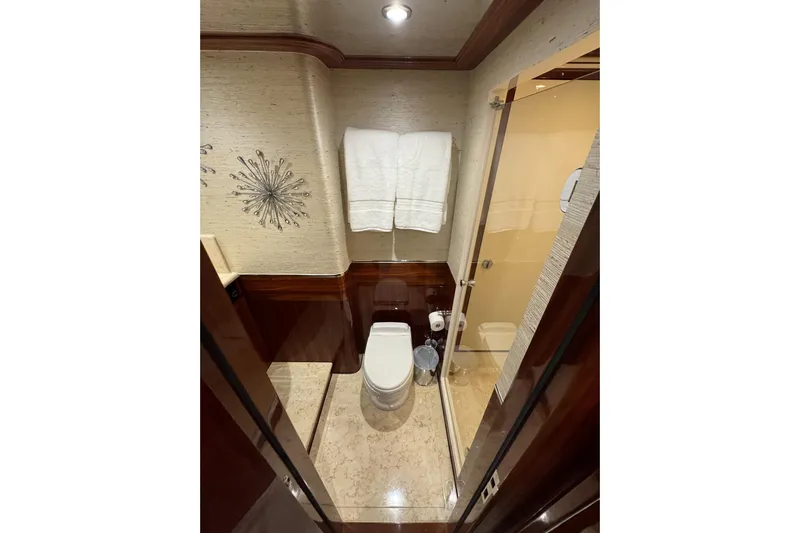 Aleniel Yacht Photos Pics Luxurious bathroom on 2005 Johnson 87' Motor Yacht with elegant decor and modern amenities.