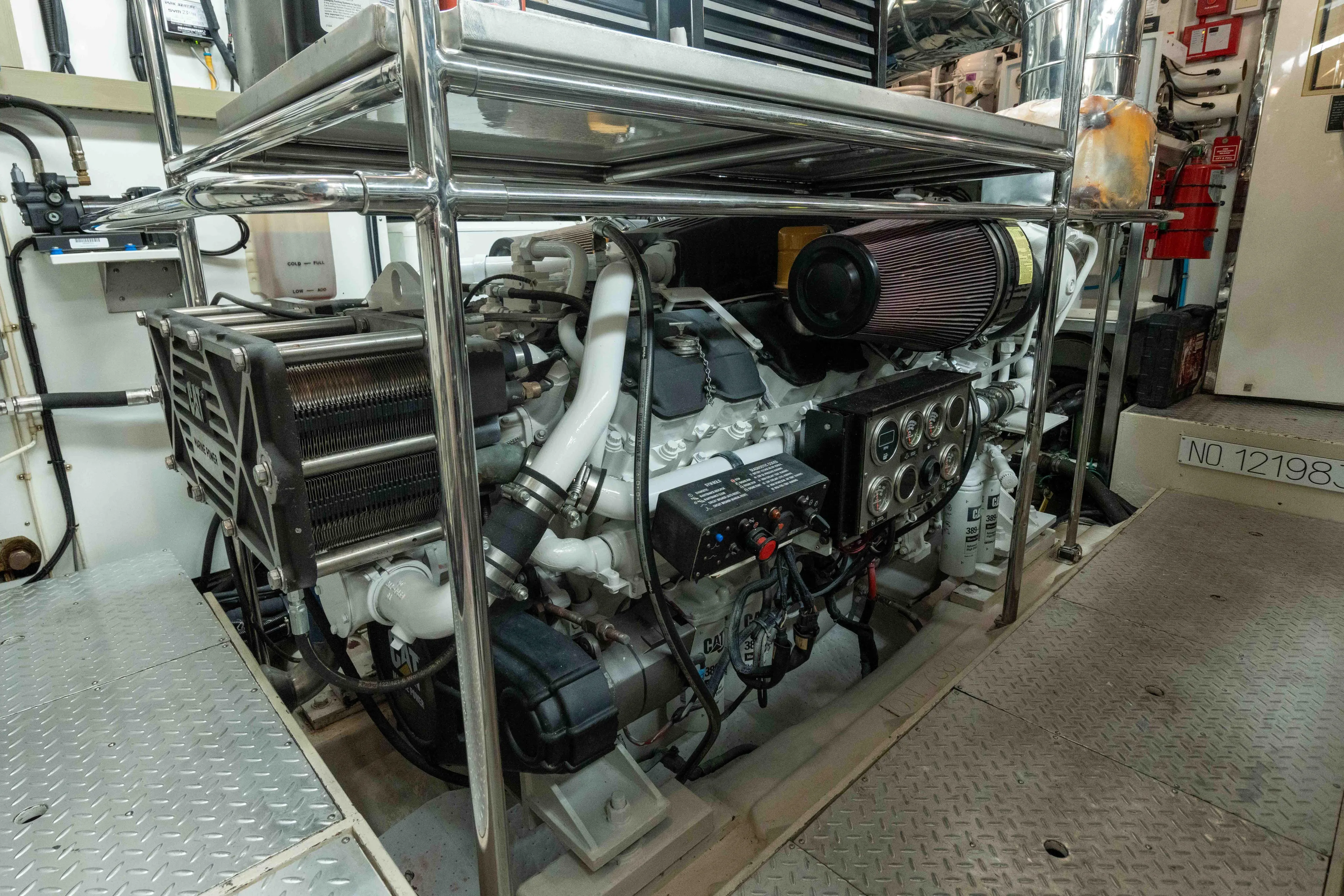 Aleniel Yacht Photos Pics Engine room of a 2005 Johnson 87' Motor Yacht, showcasing detailed machinery and components.