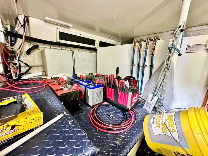 Hippeace Yacht Photos Pics Interior of 2009 Silverton Ovation 52 with tools and equipment on a diamond plate surface.