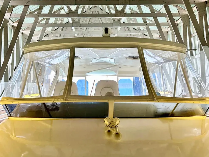 Hippeace Yacht Photos Pics 2009 Silverton Ovation 52 yacht in a boathouse, showcasing its sleek design and spacious interior.