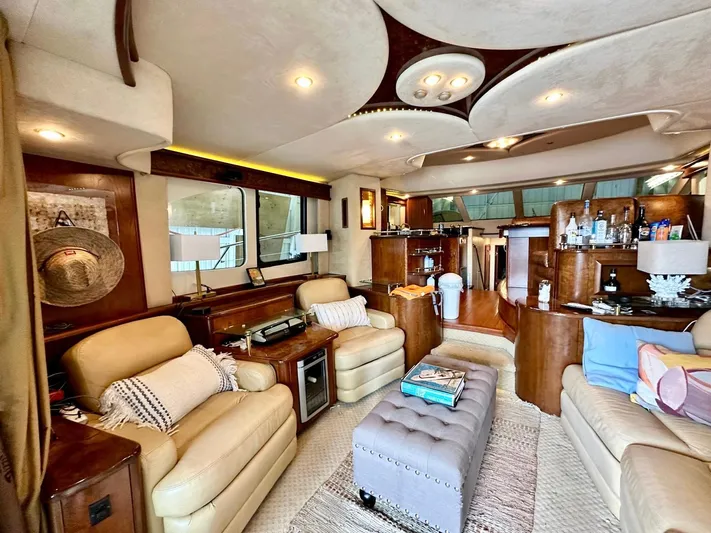 Hippeace Yacht Photos Pics Luxurious interior of 2009 Silverton Ovation 52 yacht with plush seating and elegant decor.