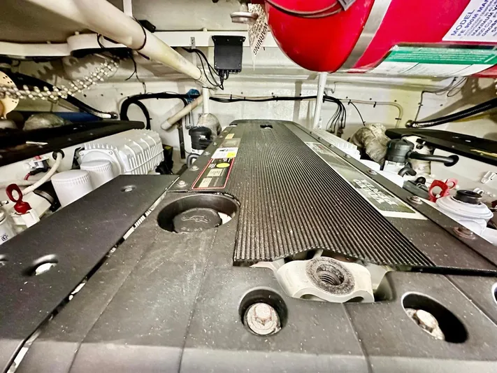 Hippeace Yacht Photos Pics Engine room of 2009 Silverton Ovation 52 yacht, showcasing mechanical components and fire extinguisher.