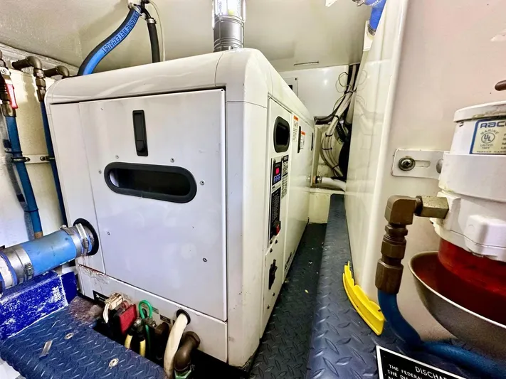 Hippeace Yacht Photos Pics Engine room of 2009 Silverton Ovation 52 yacht, featuring generator and mechanical components.