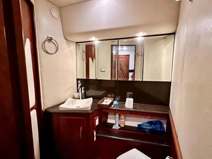 Hippeace Yacht Photos Pics Luxurious bathroom in 2009 Silverton Ovation 52 yacht with modern fixtures and ample storage.