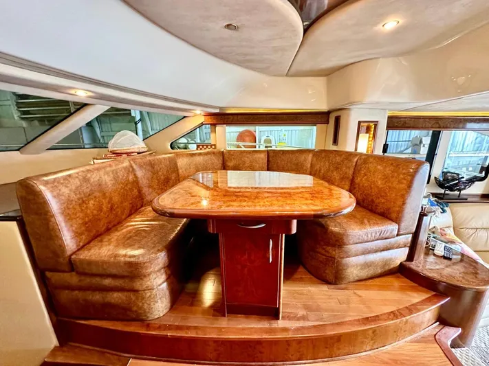 Hippeace Yacht Photos Pics Luxurious interior of 2009 Silverton Ovation 52 yacht with elegant dining area.