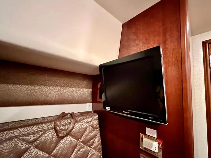 Hippeace Yacht Photos Pics 2009 Silverton Ovation 52 interior with mounted TV and patterned upholstery.