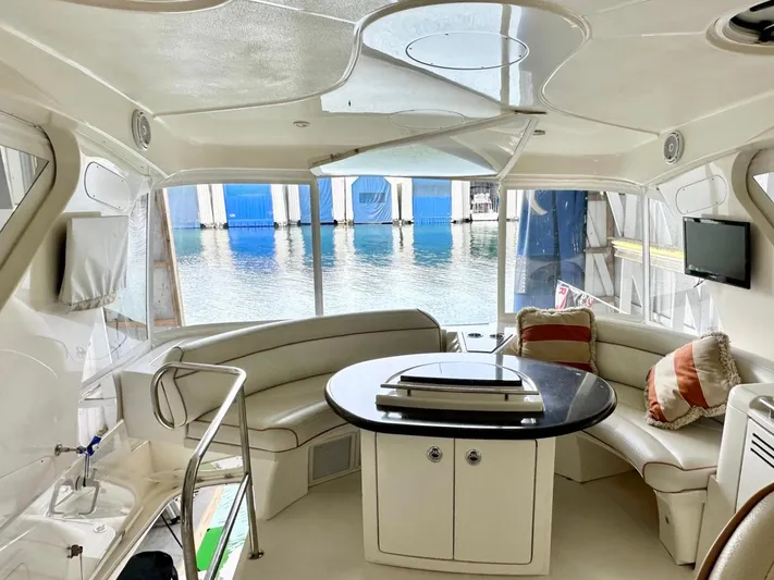 Hippeace Yacht Photos Pics Luxurious 2009 Silverton Ovation 52 yacht interior with elegant seating and waterfront view.