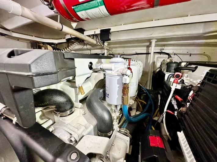 Hippeace Yacht Photos Pics Engine room of 2009 Silverton Ovation 52 yacht, featuring mechanical components and fire extinguisher.