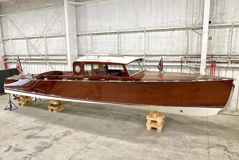 Luv N It Yacht Photos Pics Van Dam 35 boat, 2015 model, in a warehouse on wooden blocks.