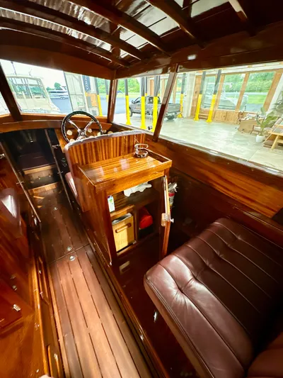 Luv N It Yacht Photos Pics Luxurious 2015 Van Dam 35 boat interior with polished wood and leather seating.