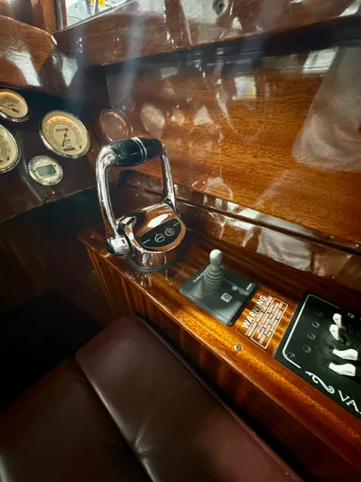 Luv N It Yacht Photos Pics Van Dam 35 boat interior, 2015 model, featuring polished wood and control panel.