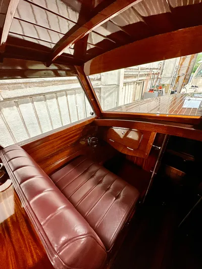 Luv N It Yacht Photos Pics Luxurious Van Dam 35 boat interior, featuring rich wood and leather seating, 2015 model.