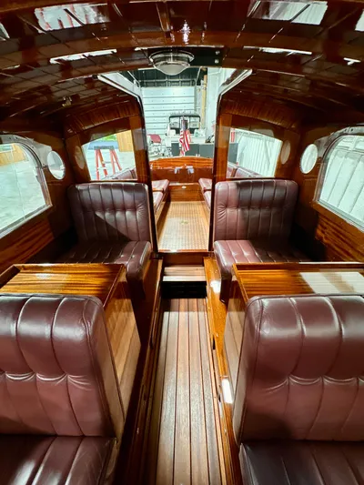 Luv N It Yacht Photos Pics Luxurious interior of 2015 Van Dam 35 boat with polished wood and leather seating.