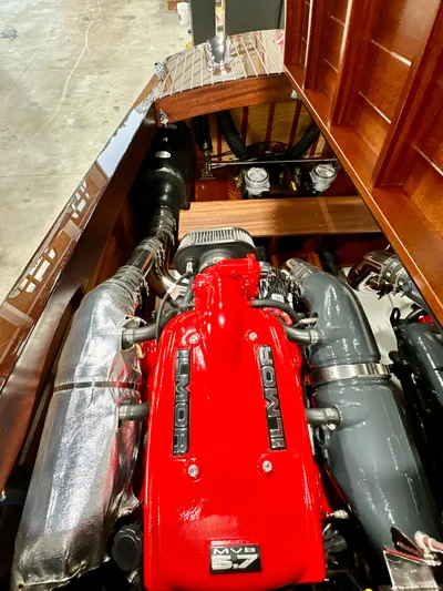 Luv N It Yacht Photos Pics Engine compartment of a 2015 Van Dam 35 boat, featuring a powerful red engine.