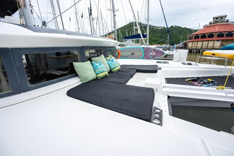  Yacht Photos Pics Luxurious Lagoon 50 catamaran deck with cushions, docked at marina, 2020 model.