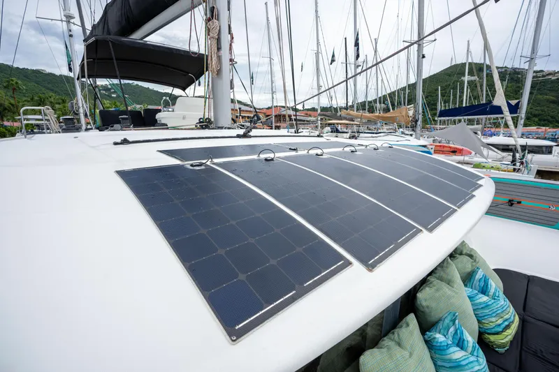  Yacht Photos Pics Lagoon 50 catamaran with solar panels on deck, docked in a marina, 2020 model.