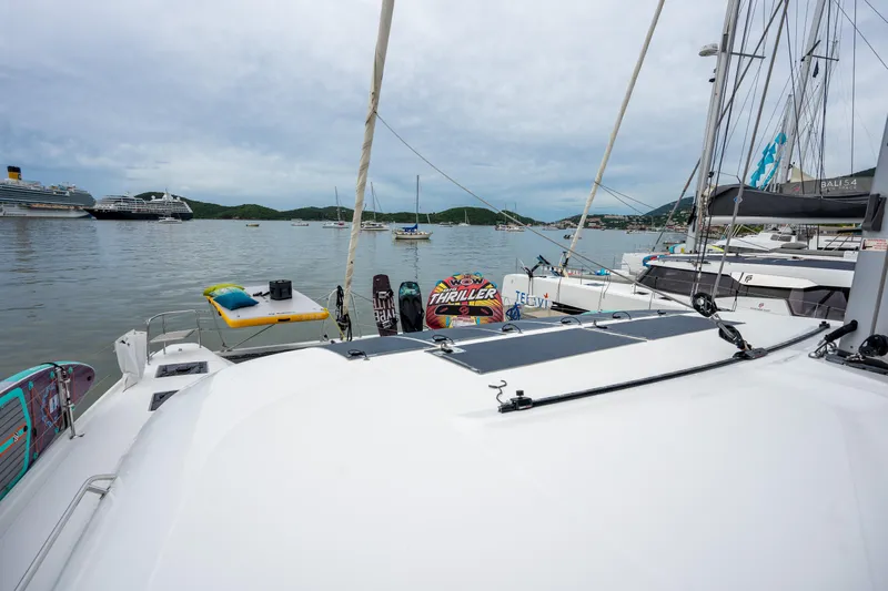  Yacht Photos Pics Lagoon 50 catamaran on calm waters, surrounded by other boats, 2020 model.