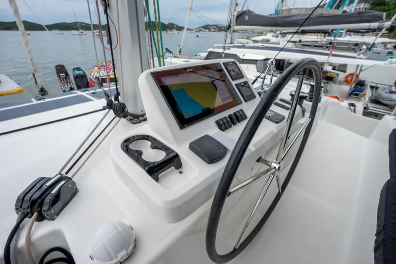  Yacht Photos Pics Helm of 2020 Lagoon 50 catamaran with navigation equipment and steering wheel.