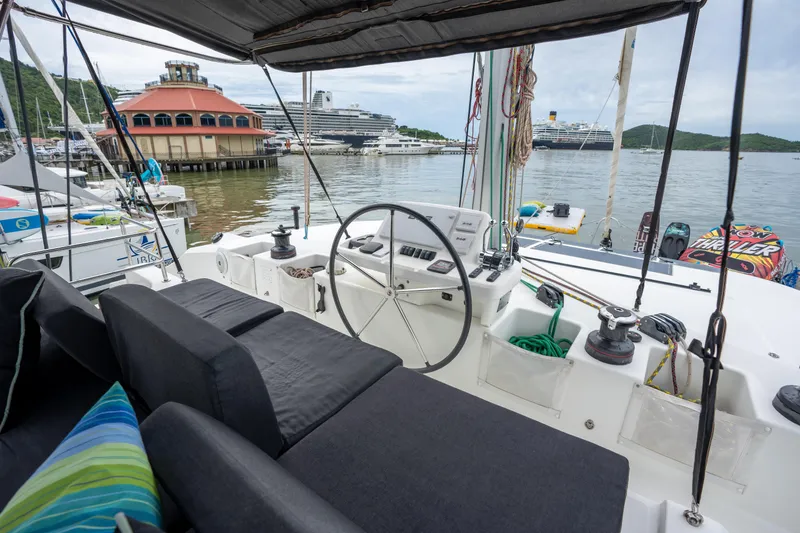  Yacht Photos Pics Cockpit view of a 2020 Lagoon 50 catamaran docked in a marina.