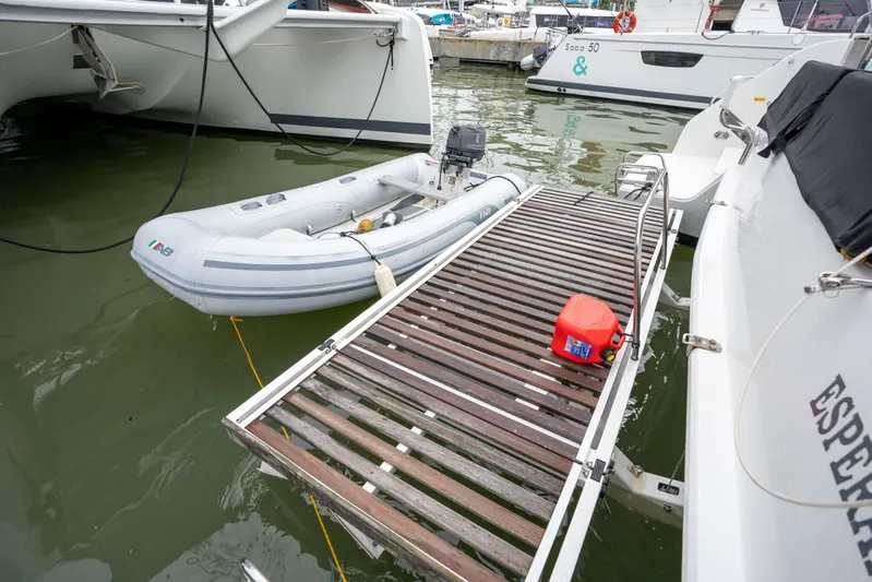  Yacht Photos Pics Docked Lagoon 50 catamaran with dinghy and fuel canister, 2020 model.