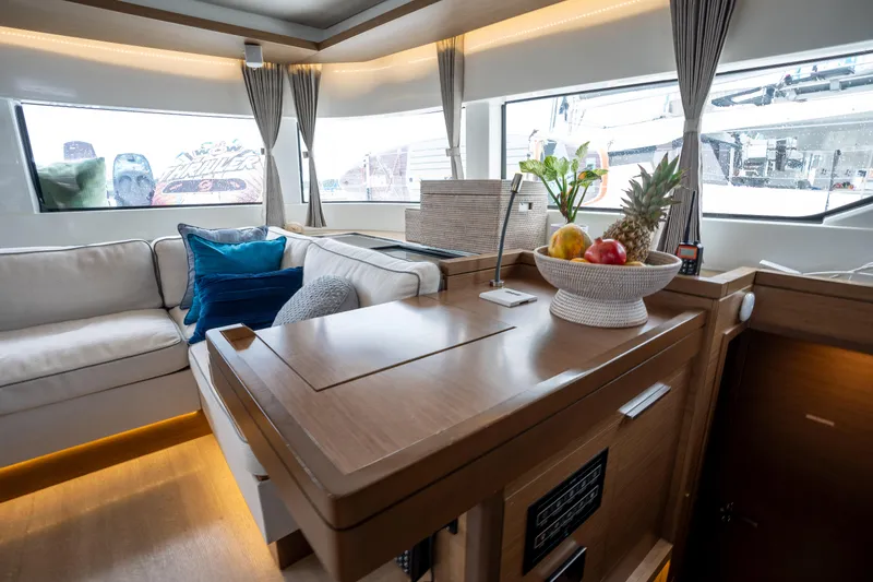  Yacht Photos Pics Interior of 2020 Lagoon 50 yacht with modern decor and fruit bowl.