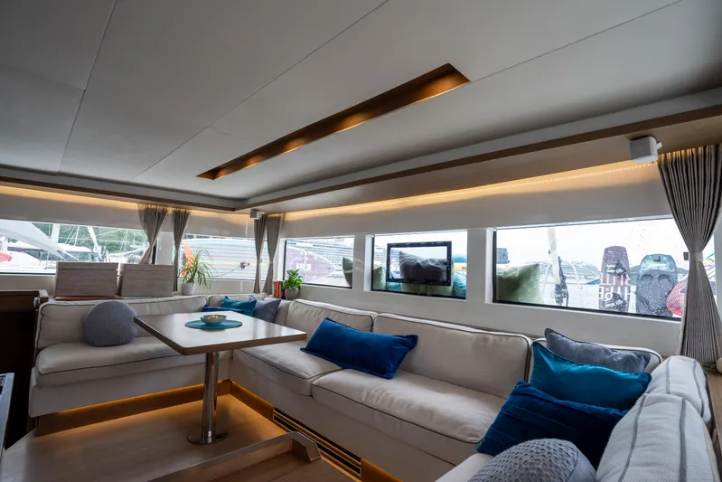  Yacht Photos Pics Luxurious interior of 2020 Lagoon 50 catamaran with elegant seating and modern decor.
