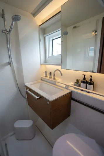  Yacht Photos Pics Modern bathroom in 2020 Lagoon 50 yacht with sleek fixtures and minimalist design.