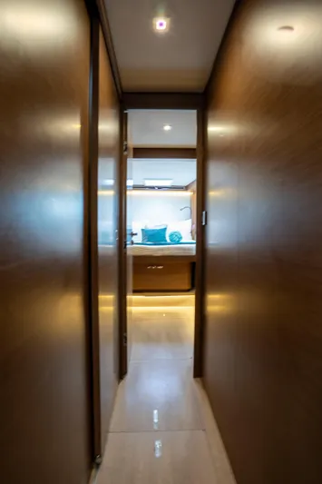  Yacht Photos Pics Interior hallway of 2020 Lagoon 50 yacht, leading to a well-lit cabin.