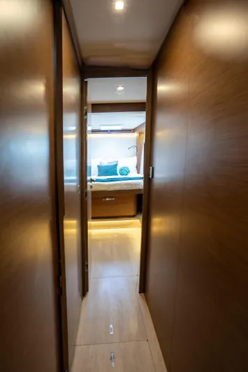  Yacht Photos Pics Hallway leading to a cozy bedroom in a 2020 Lagoon 50 yacht.