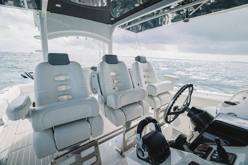 Relapse Yacht Photos Pics Luxury interior of 2021 HCB 42 Lujo boat with plush seating and ocean view.