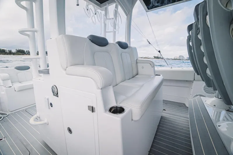 Relapse Yacht Photos Pics 2021 HCB 42 Lujo boat interior with luxurious white seating and ocean backdrop.