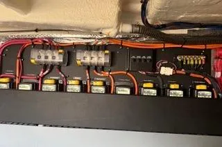  Yacht Photos Pics Electrical panel of a 2021 Regal 38 XO boat with organized wiring and components.