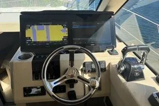  Yacht Photos Pics 2021 Regal 38 XO yacht helm with advanced navigation displays and controls.