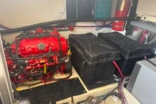  Yacht Photos Pics Engine room of 2021 Regal 38 XO with red engine and black components.
