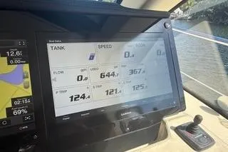  Yacht Photos Pics Dashboard of a 2021 Regal 38 XO boat displaying navigation and speed data.