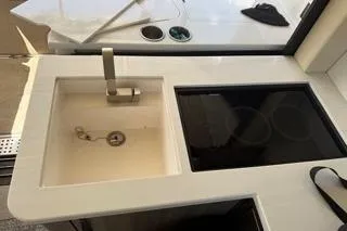  Yacht Photos Pics 2021 Regal 38 XO yacht kitchen with sink and stovetop.