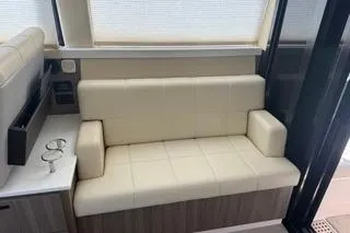  Yacht Photos Pics 2021 Regal 38 XO yacht interior with beige seating and modern design.
