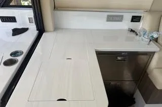  Yacht Photos Pics 2021 Regal 38 XO yacht interior with sleek countertop and modern appliances.