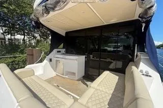  Yacht Photos Pics 2021 Regal 38 XO yacht with luxurious seating and outdoor kitchenette.