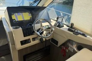 Yacht Photos Pics 2021 Regal 38 XO yacht helm with navigation display and steering wheel.