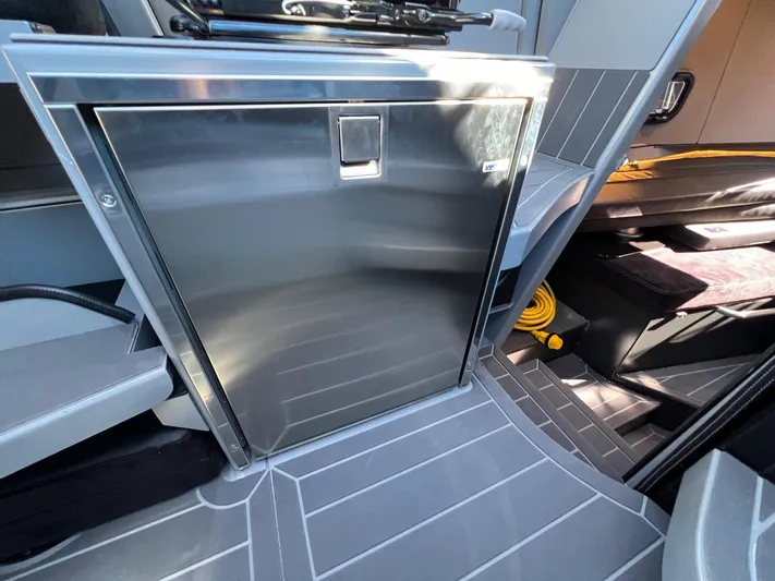 G10 Yacht Photos Pics 2024 G-Force 10 interior with sleek metallic storage compartment and modern design elements.