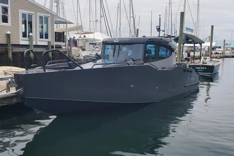 G10 Yacht Photos Pics Modern 2024 G-Force 10 boat docked at a marina, showcasing sleek design and advanced features.