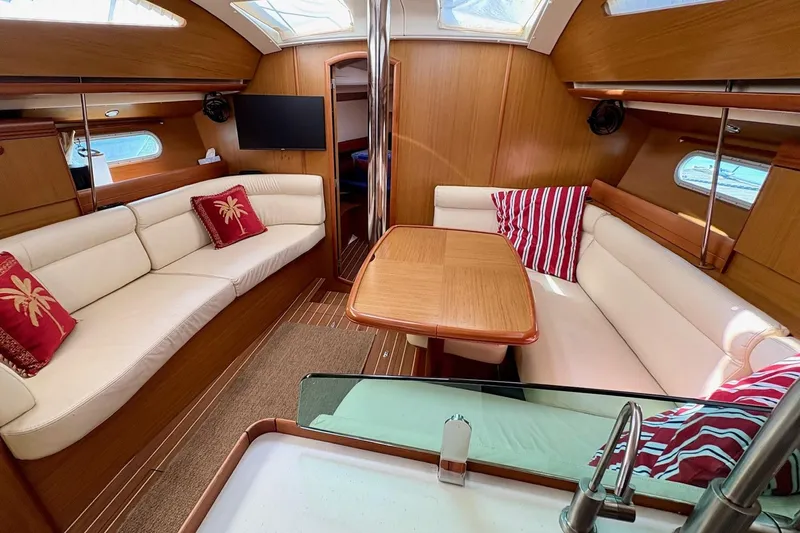 Pura Vida Yacht Photos Pics Luxurious interior of 2007 Jeanneau Sun Odyssey 42 DS sailboat with elegant seating and decor.