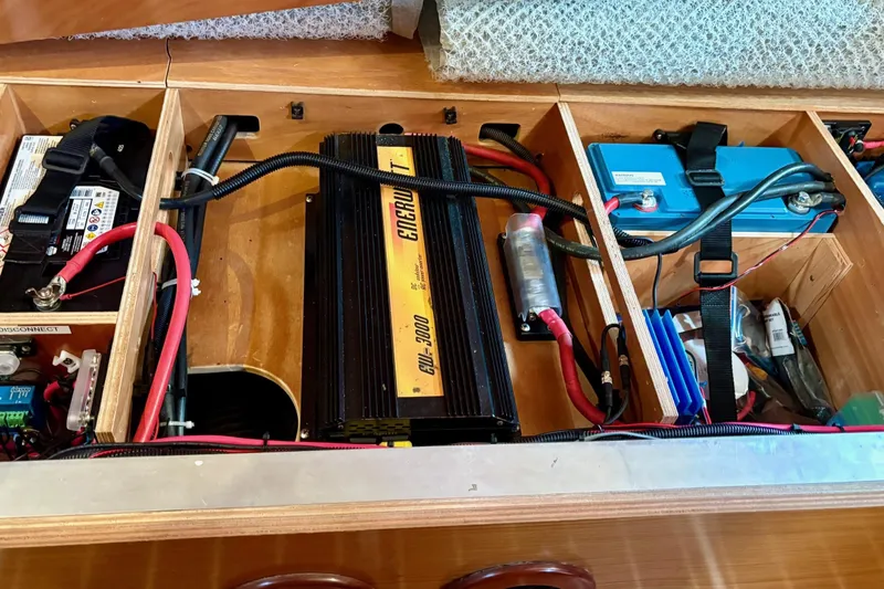 Pura Vida Yacht Photos Pics Electrical system of a 2007 Jeanneau Sun Odyssey 42 DS sailboat, featuring batteries and wiring.